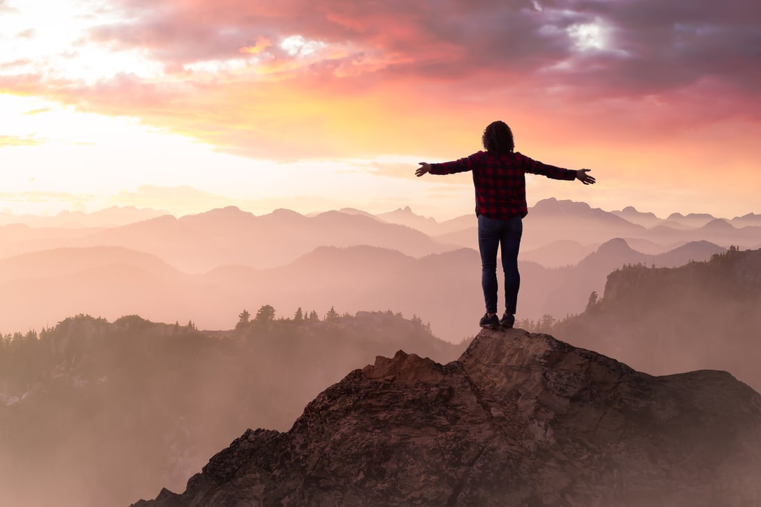 Fantasy Adventure with Girl on Top of a Mountain Cliff